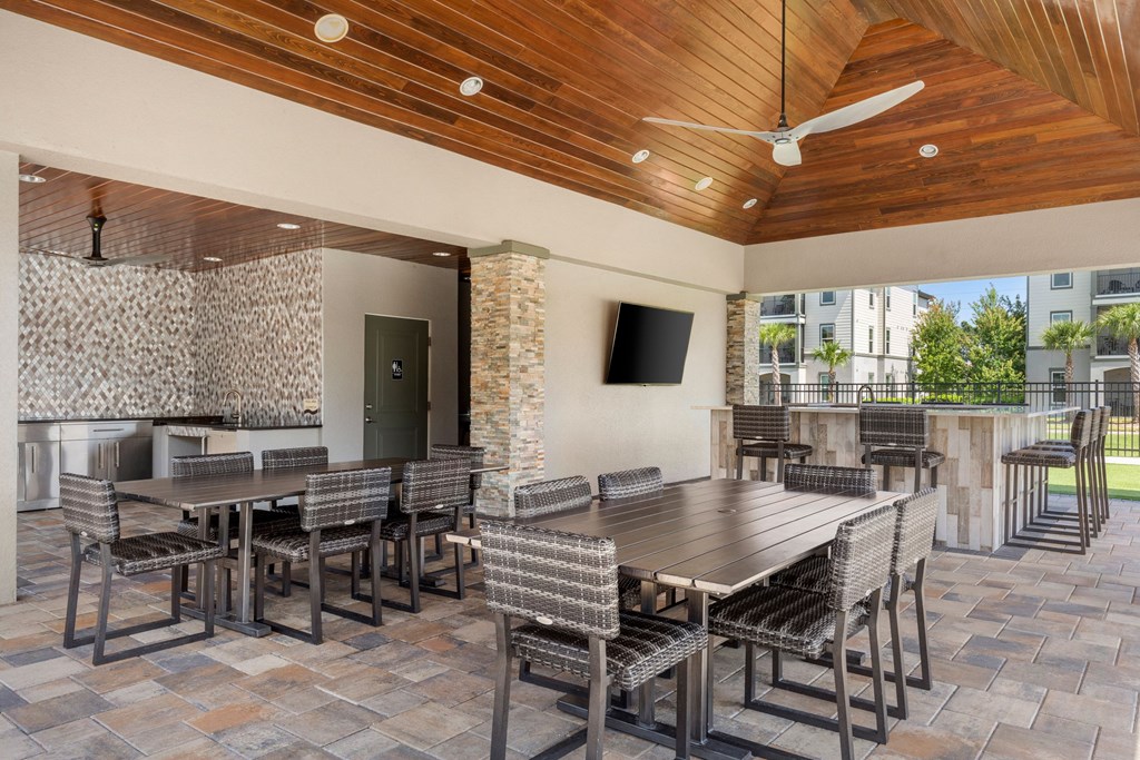 A patio with a table and chairs.