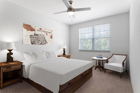 A bedroom with a San Francisco map on the wall.