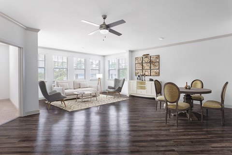 A living room with a dining table and chairs.