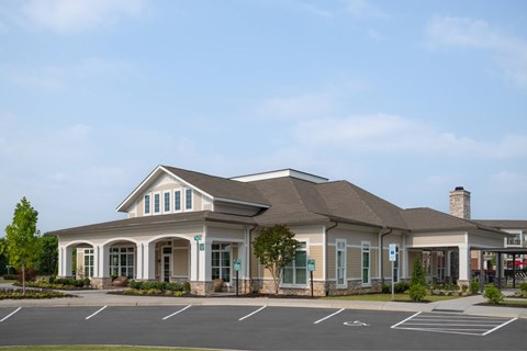A building with a parking lot in front of it.