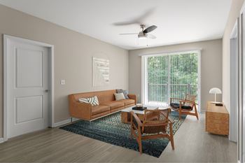 A living room with a brown sofa, a wooden table, and a ceiling fan.