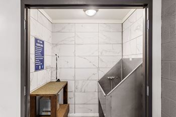 A bathroom with a sign that says