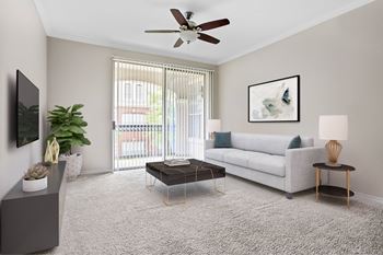 A living room with a white couch, a grey cabinet, a coffee table, a ceiling fan, and a painting on the wall.