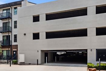 A modern building with a large garage door.