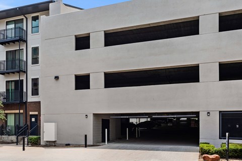 A modern building with a large garage door.