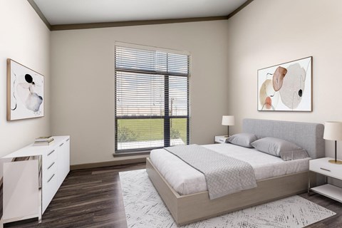 A bedroom with a large bed and a white cabinet.