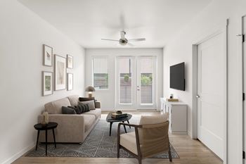 A living room with a couch, chair, and television.