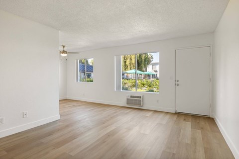 A room with a window and a door.