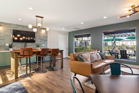 A modern dining room with a wooden table and chairs.