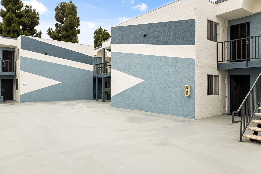 A building with blue and white stripes on the side.