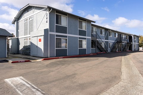 A grey building with the number 2444 on it.