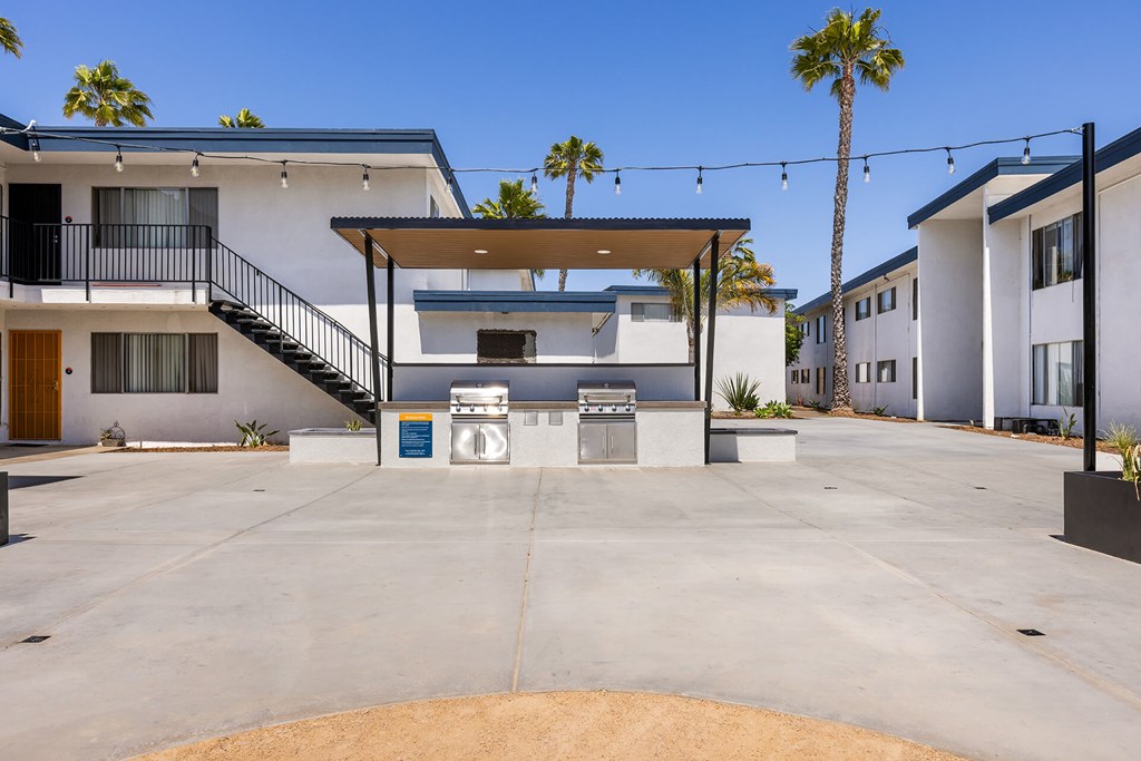 A modern house with a white exterior and a brown door.