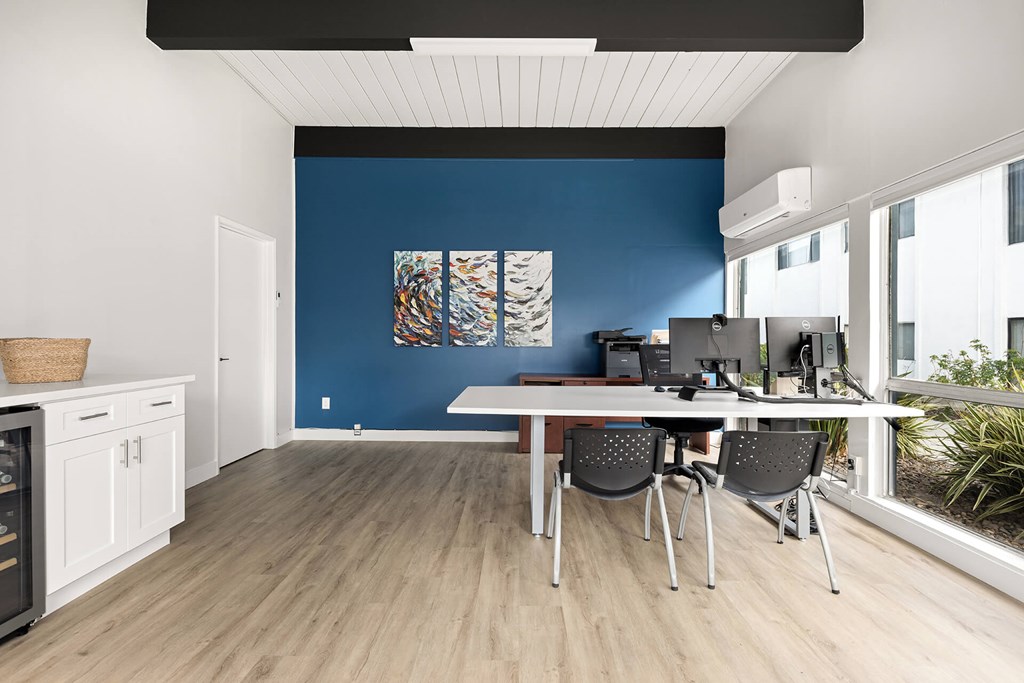 A room with a table and chairs in it.