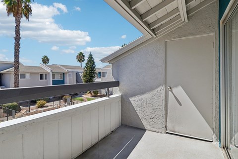A white wall with a sliding door in the middle of it.