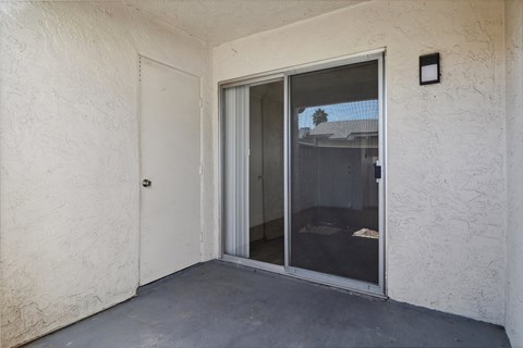 A white door with a glass window is closed.