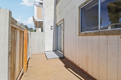 A concrete building with a window and a door.