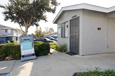 A sign in front of a building that says