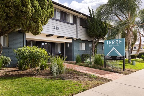 A sign for Terra at Lincoln is displayed in front of a building.