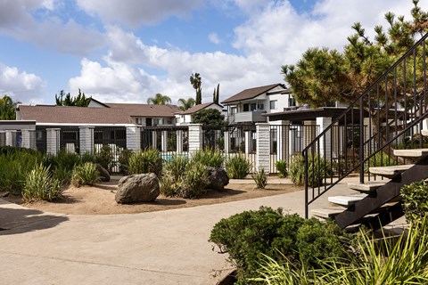 A building with a metal staircase in front of it.