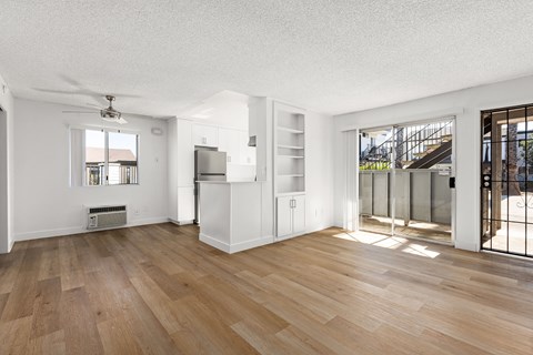 A room with wooden floors and white walls.