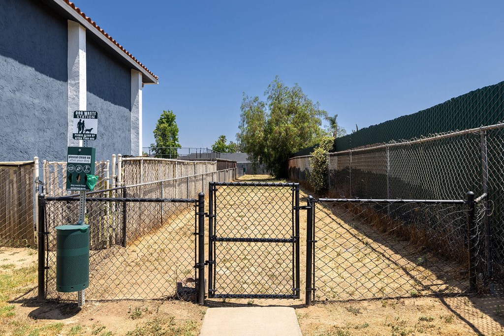 A gate blocks the entrance to a fenced area.
