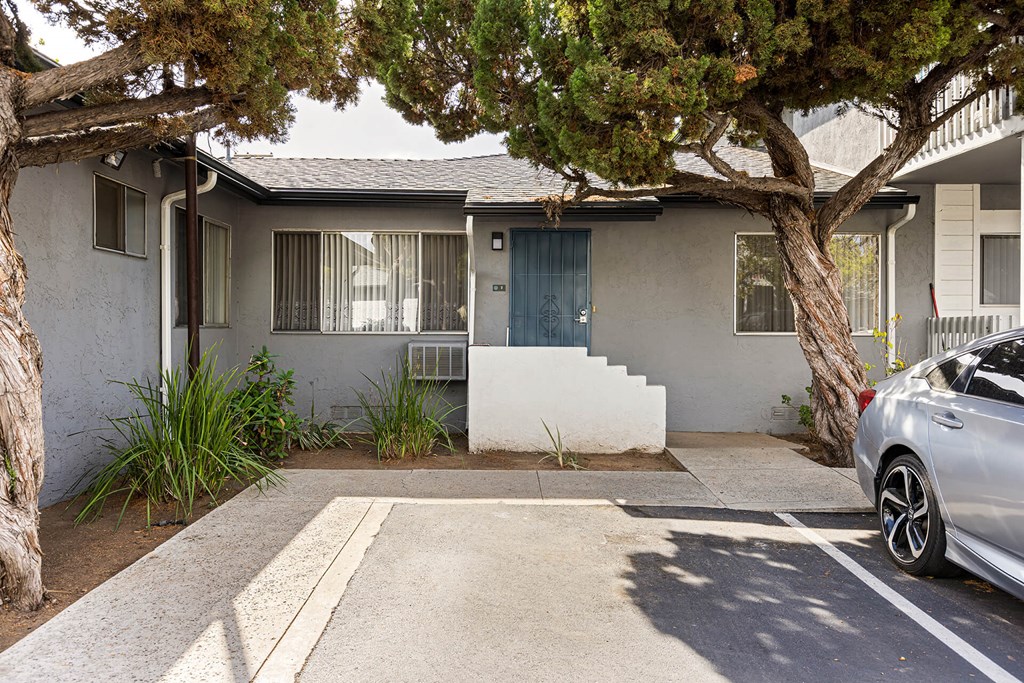 A house with a tree in front of it.