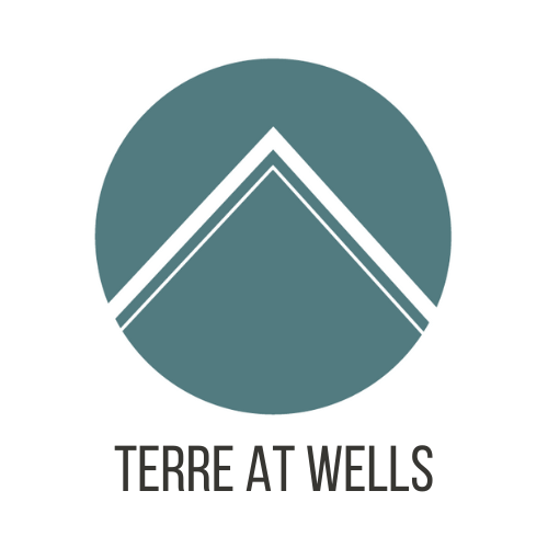 A logo with the text "TERRE AT WELLS" below it.