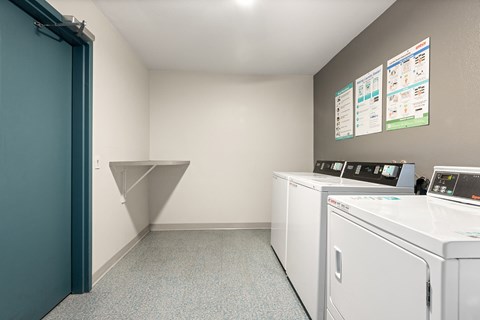A laundry room with a washer and dryer.