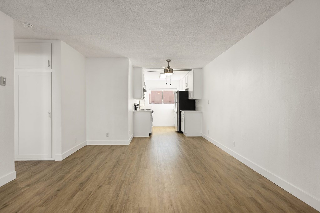 A room with wooden floors and white walls.
