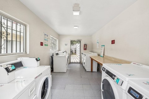 A laundromat with washers and dryers.