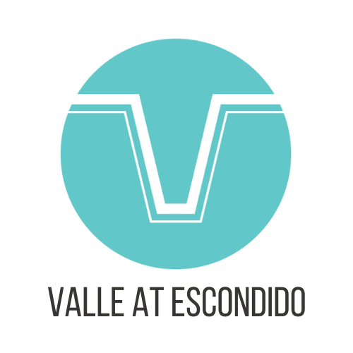 A logo with the text "Vallarta Escondido" below it.