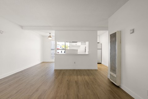 A room with wooden floors and white walls.