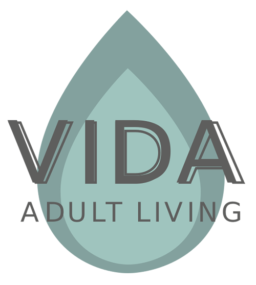 A logo with a water droplet design and the words "Vida Adult Living".
