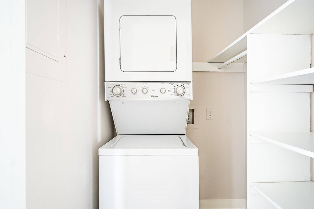 A white oven and dishwasher in a kitchen.