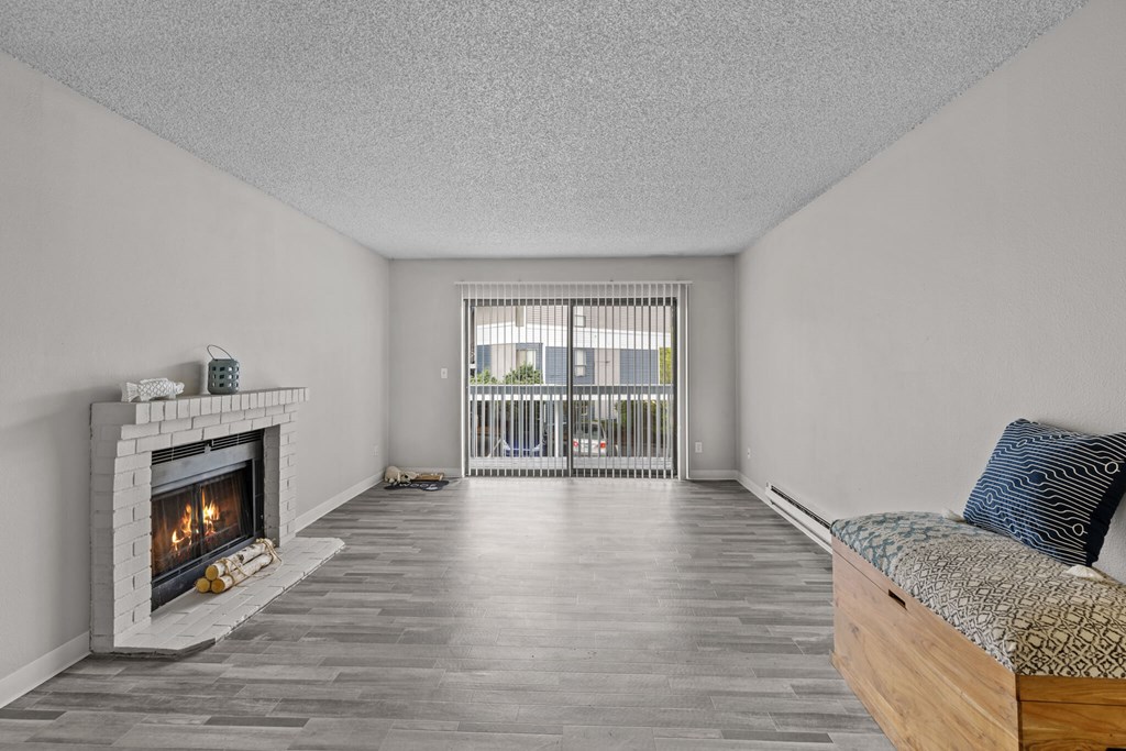 A room with a fireplace and a bed.