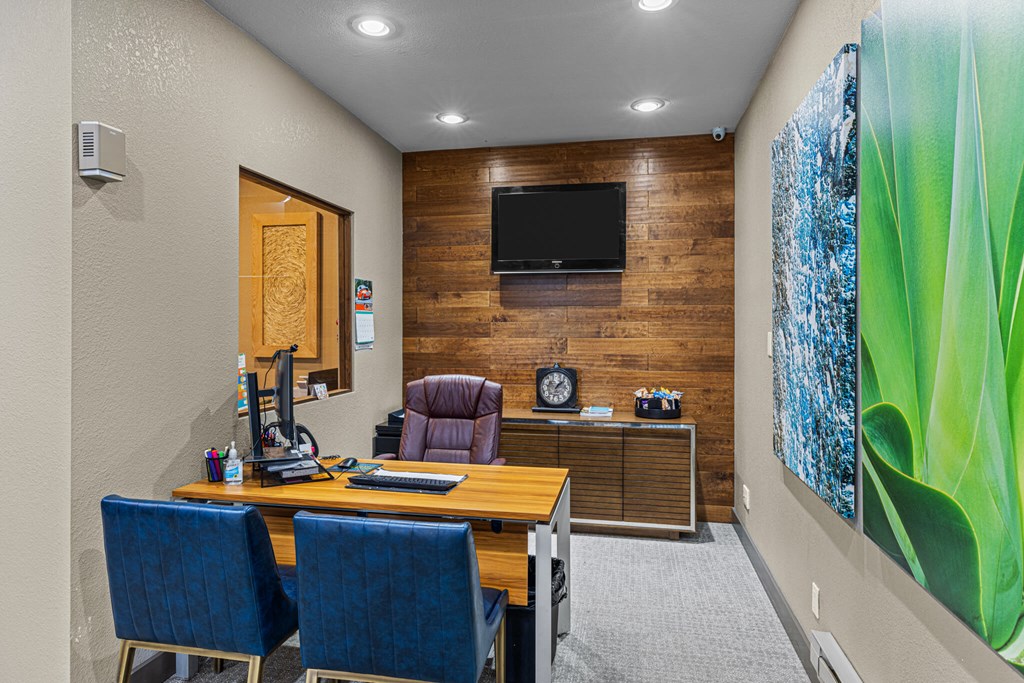 A room with a wooden wall and a television mounted on it.
