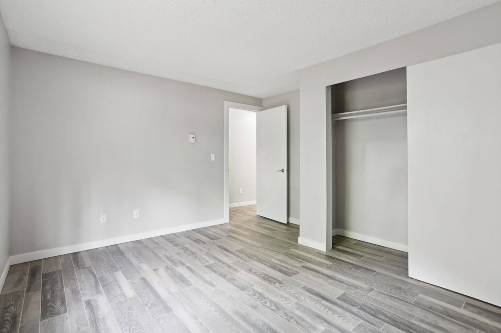 A room with a grey floor and white walls.
