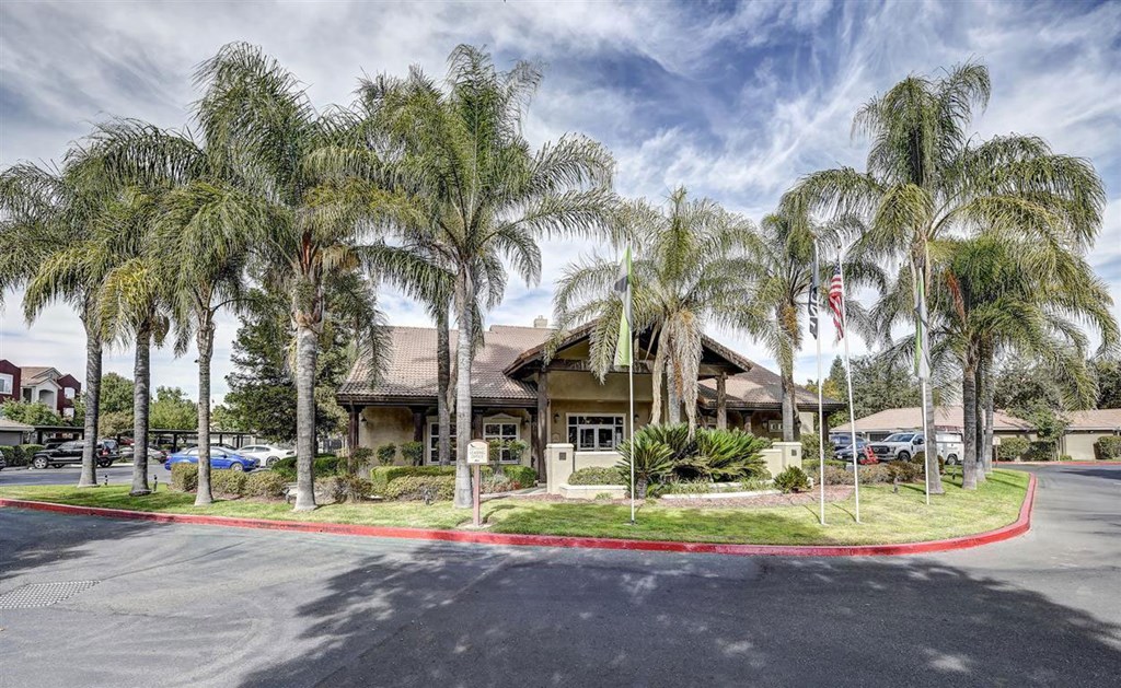 A building with a red curb in front of it.