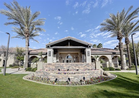 A house with a stone staircase leading to the front door.