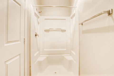 A white pantry with a door open to a white cabinet.