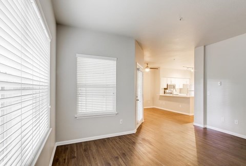 A room with wooden floors and white walls.