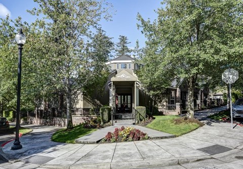 A house with a front yard and a street lamp.