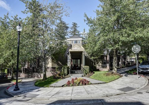 A house with a front yard and a street lamp.