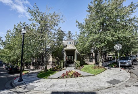 A street view of a residential area with a house in the center.