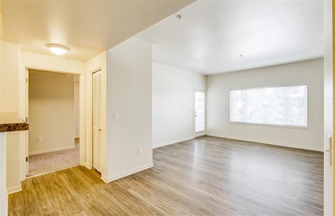 A room with wooden floors and white walls.