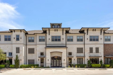 A large, modern building with a symmetrical facade and a central entrance.