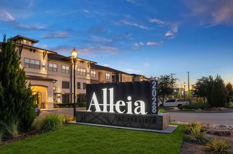 A sign that says Alleia in front of a building.