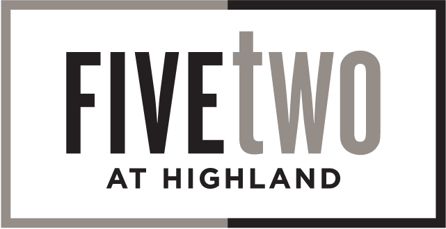 A green sign with the words "FIVE TWO AT HIGHLAND" on it.