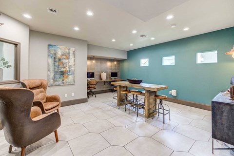 A modern dining room with a wooden table and chairs.