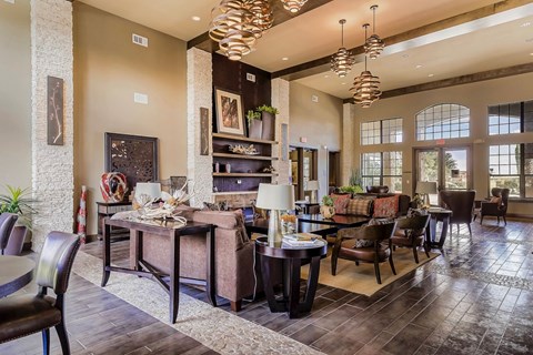 A large, well-lit dining room with a long table and chairs.